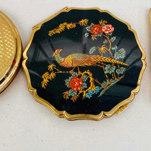 Four mid-20th-century gilt metal powder compacts ro include Stratton, a ...