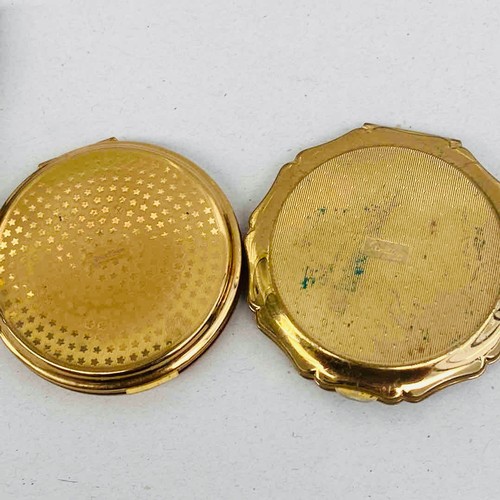 Four mid-20th-century gilt metal powder compacts ro include Stratton, a ...