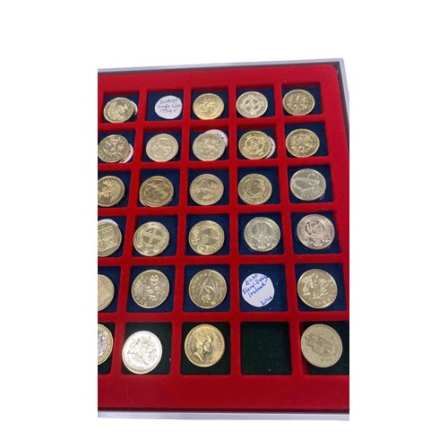 Collection of United Kingdom one-pound coins featuring assorted ...