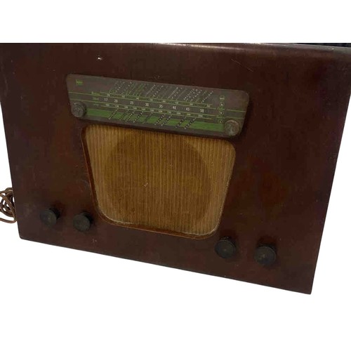 55 - A Mid-Century Murphy valve radio receiver, model A130, in a curved case with green station dial, tex... 