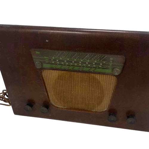 55 - A Mid-Century Murphy valve radio receiver, model A130, in a curved case with green station dial, tex... 