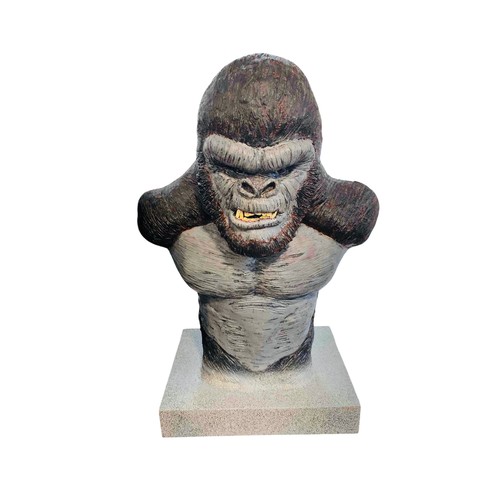 39 - A large painted sculptural bust of a King Kong gorilla, modelled with exaggerated shoulders and bare... 