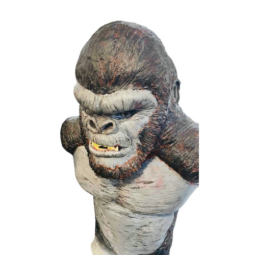 39 - A large painted sculptural bust of a King Kong gorilla, modelled with exaggerated shoulders and bare... 