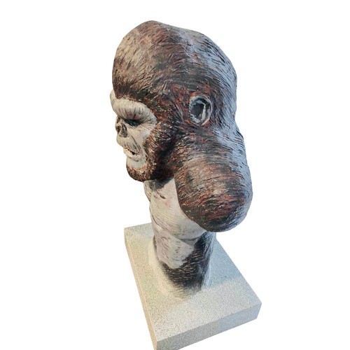 39 - A large painted sculptural bust of a King Kong gorilla, modelled with exaggerated shoulders and bare... 