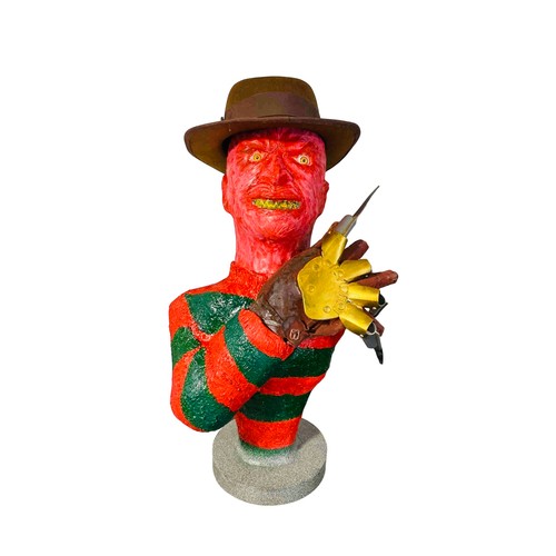 45 - A contemporary painted bust Freddy Krueger model of a horror character, in red and green striped swe... 