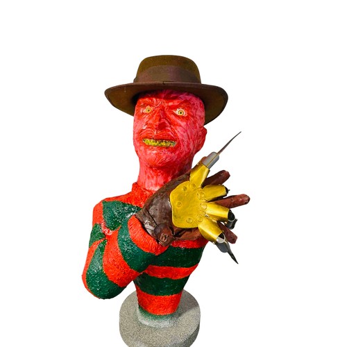 45 - A contemporary painted bust Freddy Krueger model of a horror character, in red and green striped swe... 