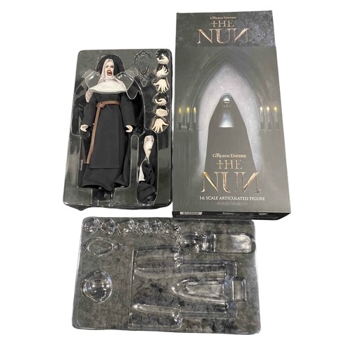 19 - A boxed 1:6 scale articulated horror figure from The Conjuring Universe: The Nun, with interchangeab... 