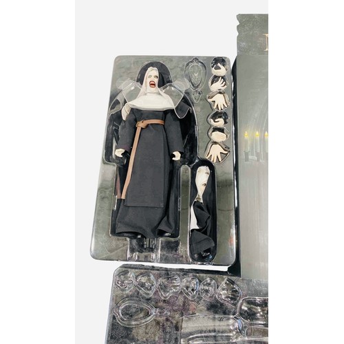 19 - A boxed 1:6 scale articulated horror figure from The Conjuring Universe: The Nun, with interchangeab... 