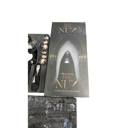19 - A boxed 1:6 scale articulated horror figure from The Conjuring Universe: The Nun, with interchangeab... 