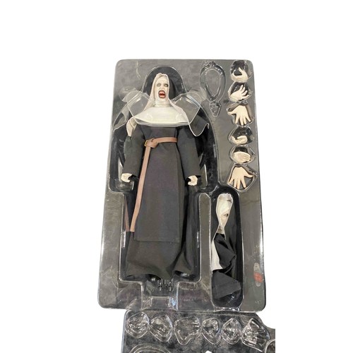 19 - A boxed 1:6 scale articulated horror figure from The Conjuring Universe: The Nun, with interchangeab... 