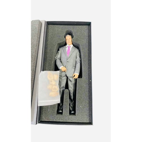 18 - A Kento Studio 1/6th scale hand-made collectible male figure in a pinstripe suit with purple tie, pr... 