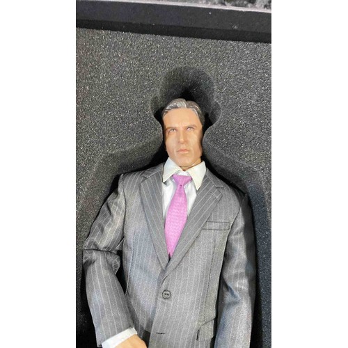 18 - A Kento Studio 1/6th scale hand-made collectible male figure in a pinstripe suit with purple tie, pr... 