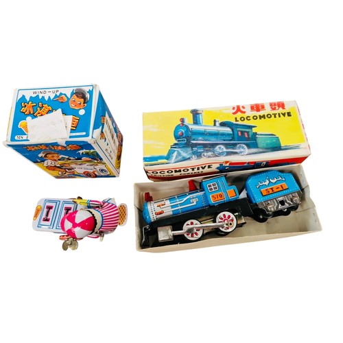 20 - A group of Chinese tinplate clockwork toys, comprising a friction-powered locomotive with tender and... 