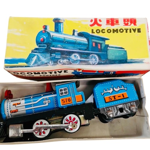 20 - A group of Chinese tinplate clockwork toys, comprising a friction-powered locomotive with tender and... 