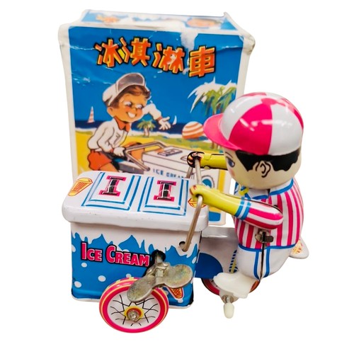 20 - A group of Chinese tinplate clockwork toys, comprising a friction-powered locomotive with tender and... 