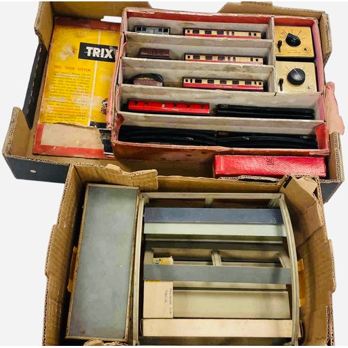 51 - A group of vintage Trix model railway items, including passenger coaches, goods wagons, controllers ... 