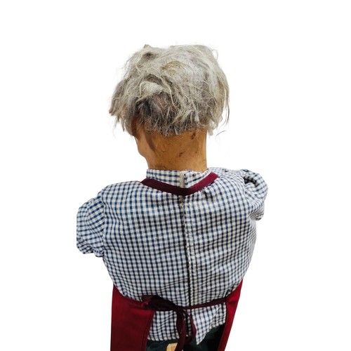13 - A working automaton figure display of a cobbler, with grey hair, articulated arms holding hammer and... 