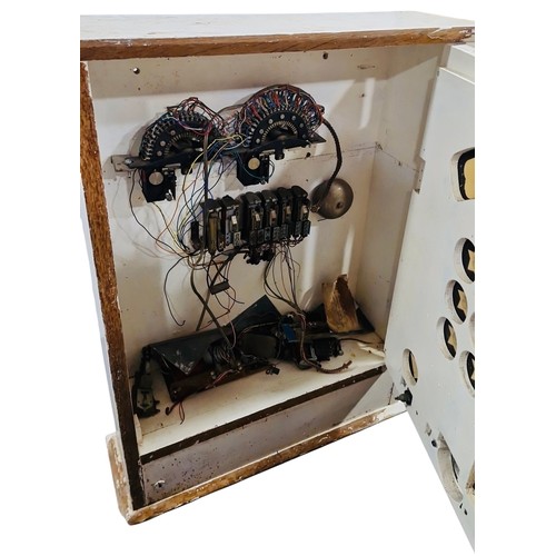 12 - A vintage Bingola mechanical arcade or pub game in a painted wooden cabinet, with printed score glas... 