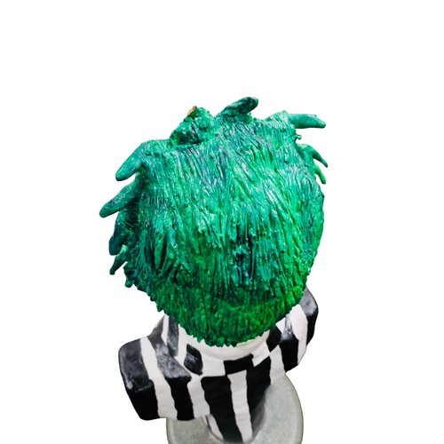 42 - A painted bust model of a Beetlejuice, green-haired character in black-and-white striped suit, mount... 