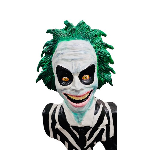 42 - A painted bust model of a Beetlejuice, green-haired character in black-and-white striped suit, mount... 