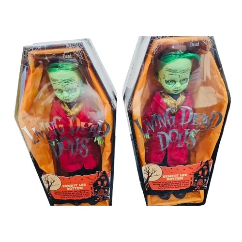 41 - A group of Living Dead Dolls Halloween-themed figures in coffin-form window boxes, including charact... 