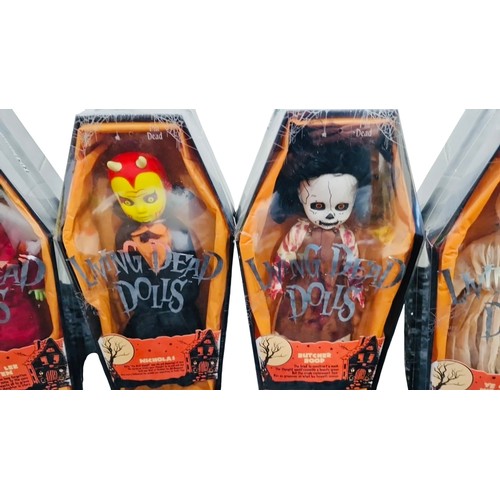 41 - A group of Living Dead Dolls Halloween-themed figures in coffin-form window boxes, including charact... 