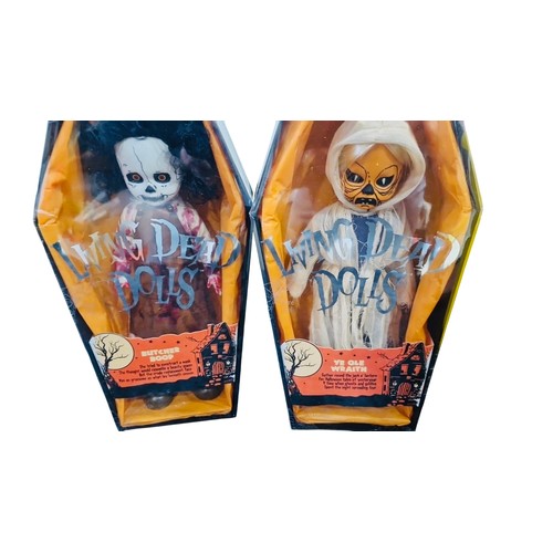 41 - A group of Living Dead Dolls Halloween-themed figures in coffin-form window boxes, including charact... 