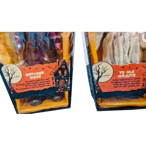 41 - A group of Living Dead Dolls Halloween-themed figures in coffin-form window boxes, including charact... 