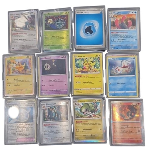 23 - A group of Pokemon trading cards in rigid plastic protectors, including Copperajah, Pineco, Basic Wa... 