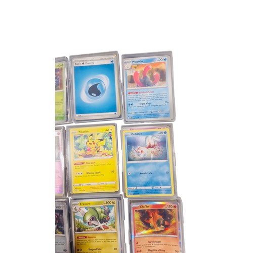 23 - A group of Pokemon trading cards in rigid plastic protectors, including Copperajah, Pineco, Basic Wa... 