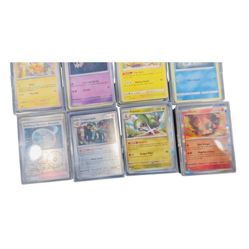 23 - A group of Pokemon trading cards in rigid plastic protectors, including Copperajah, Pineco, Basic Wa... 