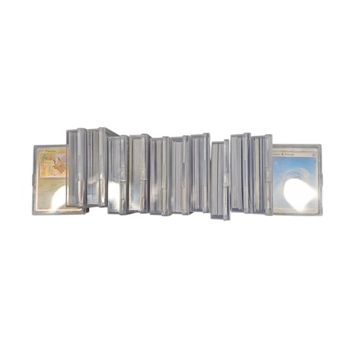 23 - A group of Pokemon trading cards in rigid plastic protectors, including Copperajah, Pineco, Basic Wa... 