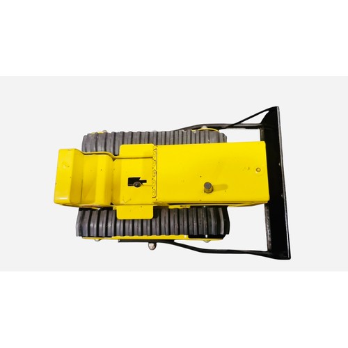 23C - A Tonka pressed-metal toy tracked bulldozer, in yellow and black with rubber tracks, front blade, gl... 