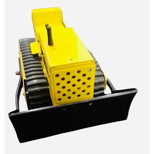23C - A Tonka pressed-metal toy tracked bulldozer, in yellow and black with rubber tracks, front blade, gl... 