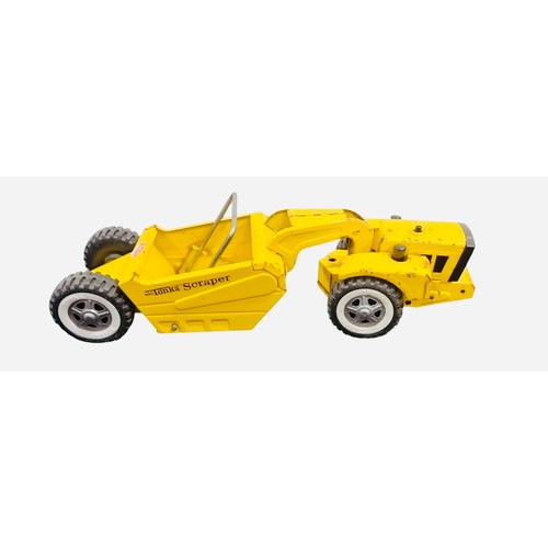 23E - A Tonka mini Tonka Scraper die-cast construction toy in yellow, with articulated tractor and scraper... 
