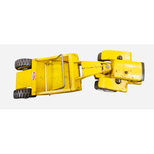 23E - A Tonka mini Tonka Scraper die-cast construction toy in yellow, with articulated tractor and scraper... 