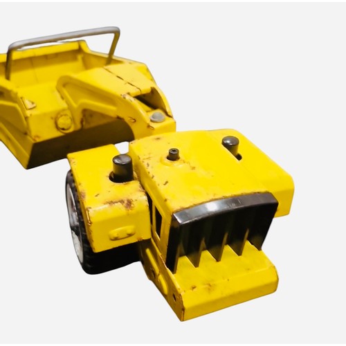 23E - A Tonka mini Tonka Scraper die-cast construction toy in yellow, with articulated tractor and scraper... 