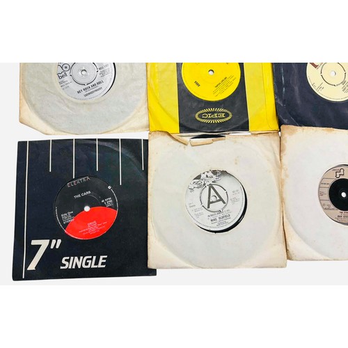 A group of 7-inch 45 rpm vinyl singles in assorted paper company ...