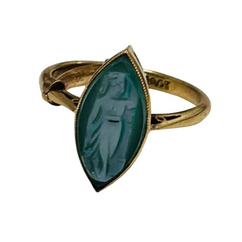 40 - 18ct gold ring set with a marquise green hardstone cameo, carved with a robed standing figure; the b... 