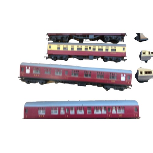 69 - A collection of mainly Hornby model railway rolling stock and locomotives, including maroon-and-grey... 