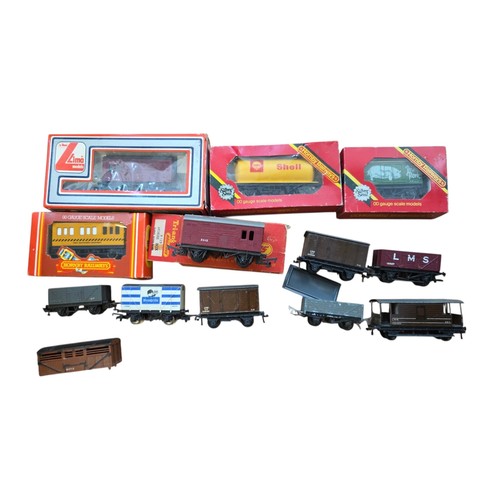 72 - A group of OO gauge model railway rolling stock, including Hornby Railways and Lima boxed wagons and... 