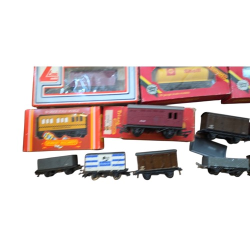 72 - A group of OO gauge model railway rolling stock, including Hornby Railways and Lima boxed wagons and... 