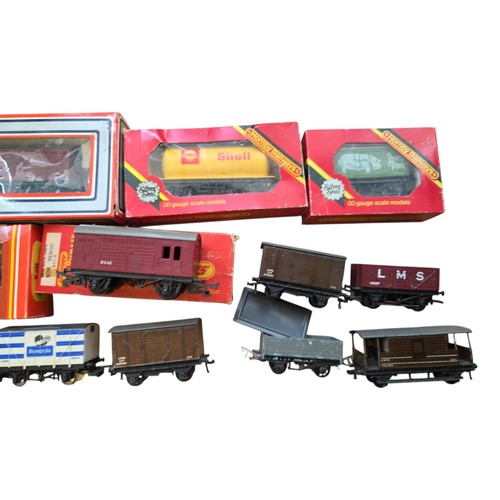 72 - A group of OO gauge model railway rolling stock, including Hornby Railways and Lima boxed wagons and... 