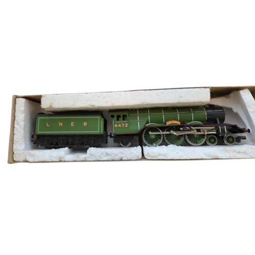 75 - A group of model railway items including Hornby Railways rolling stock and a green LNER locomotive n... 
