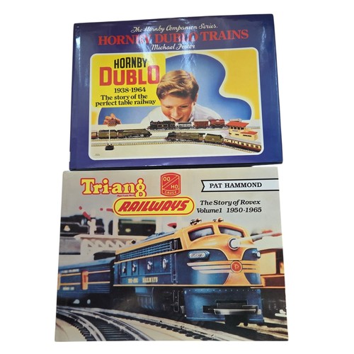 83 - A group of illustrated reference books on model railways, including Michael Foster's Hornby Dublo Tr... 