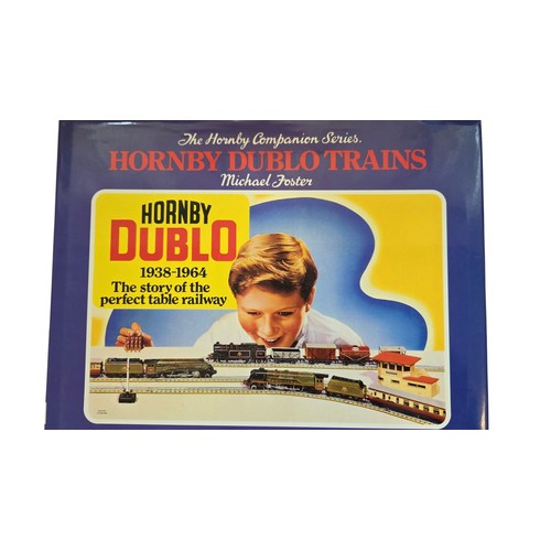 83 - A group of illustrated reference books on model railways, including Michael Foster's Hornby Dublo Tr... 