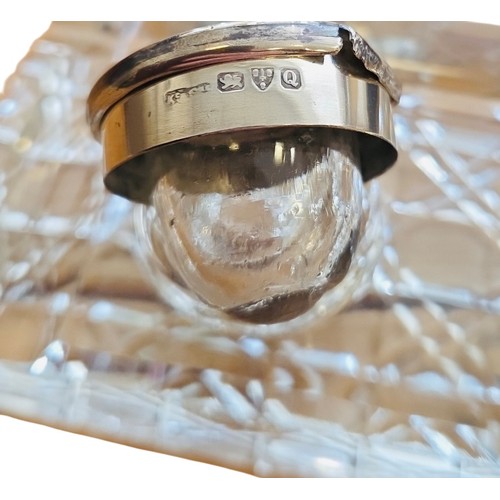 56 - A group comprising a sterling silver photograph frame and a cut-glass double inkwell, the latter wit... 