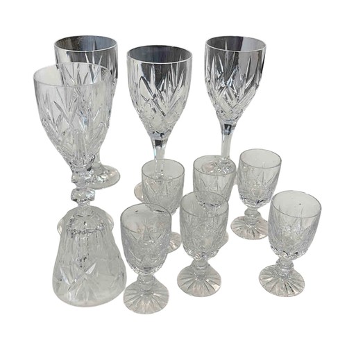 A suite of cut glass stemware, including wine glasses and small liqueur ...