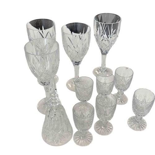 A suite of cut glass stemware, including wine glasses and small liqueur ...