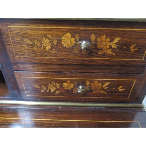 296 - A 19th century inlaid rosewood bonheur de jour with a brass gallery on five drawer upstand with a fo... 